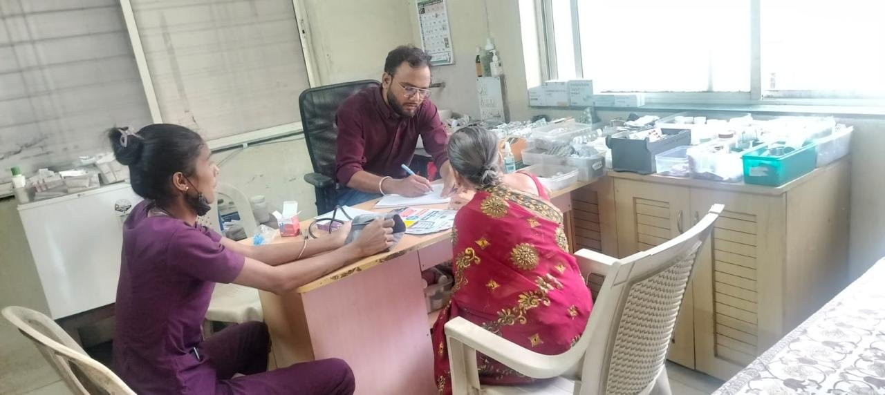 Doctor Consulting Elderly Patient